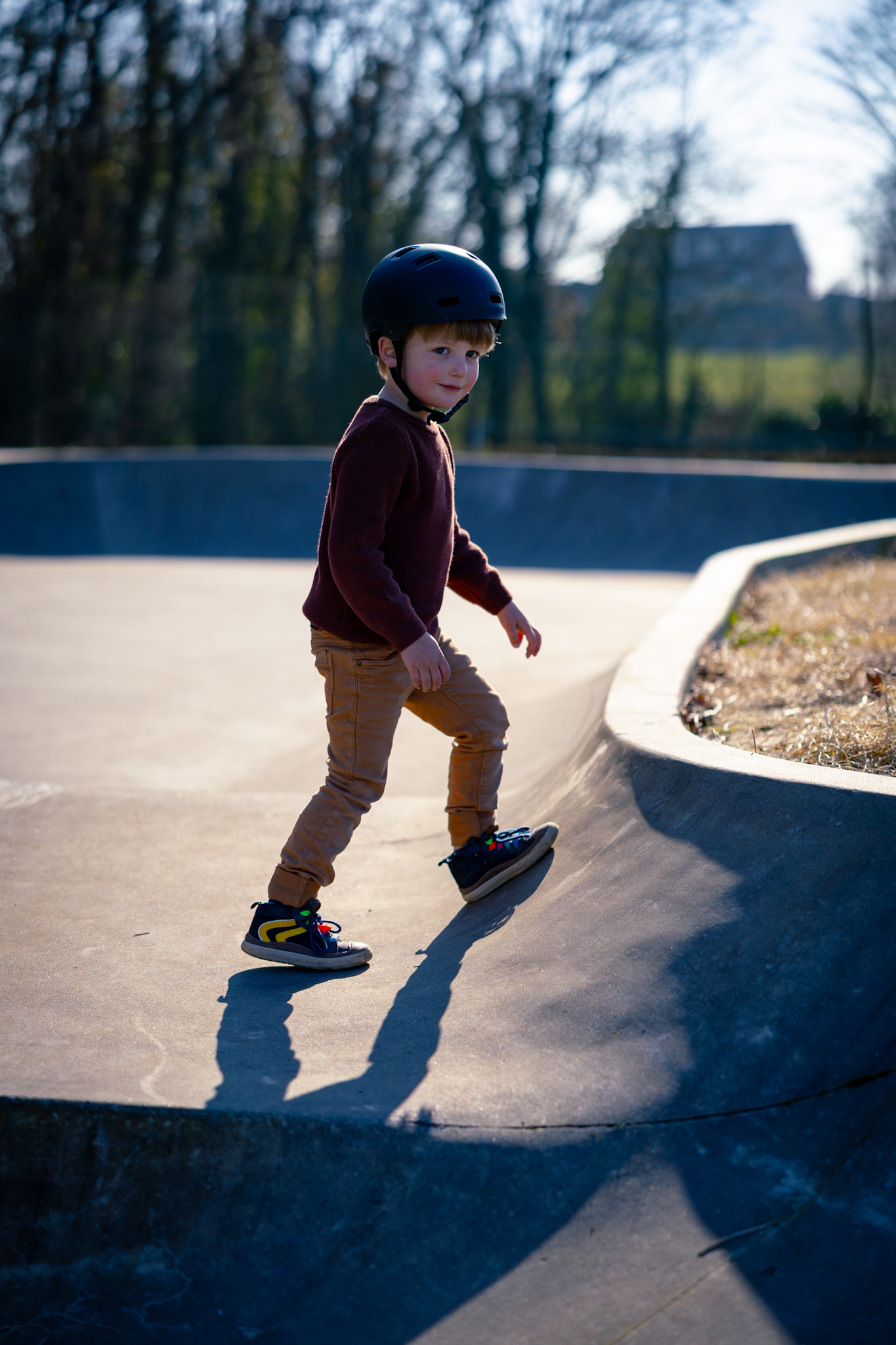 Boy walking skatepark, photography
