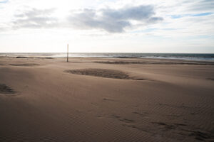 Sunset at stormy beach