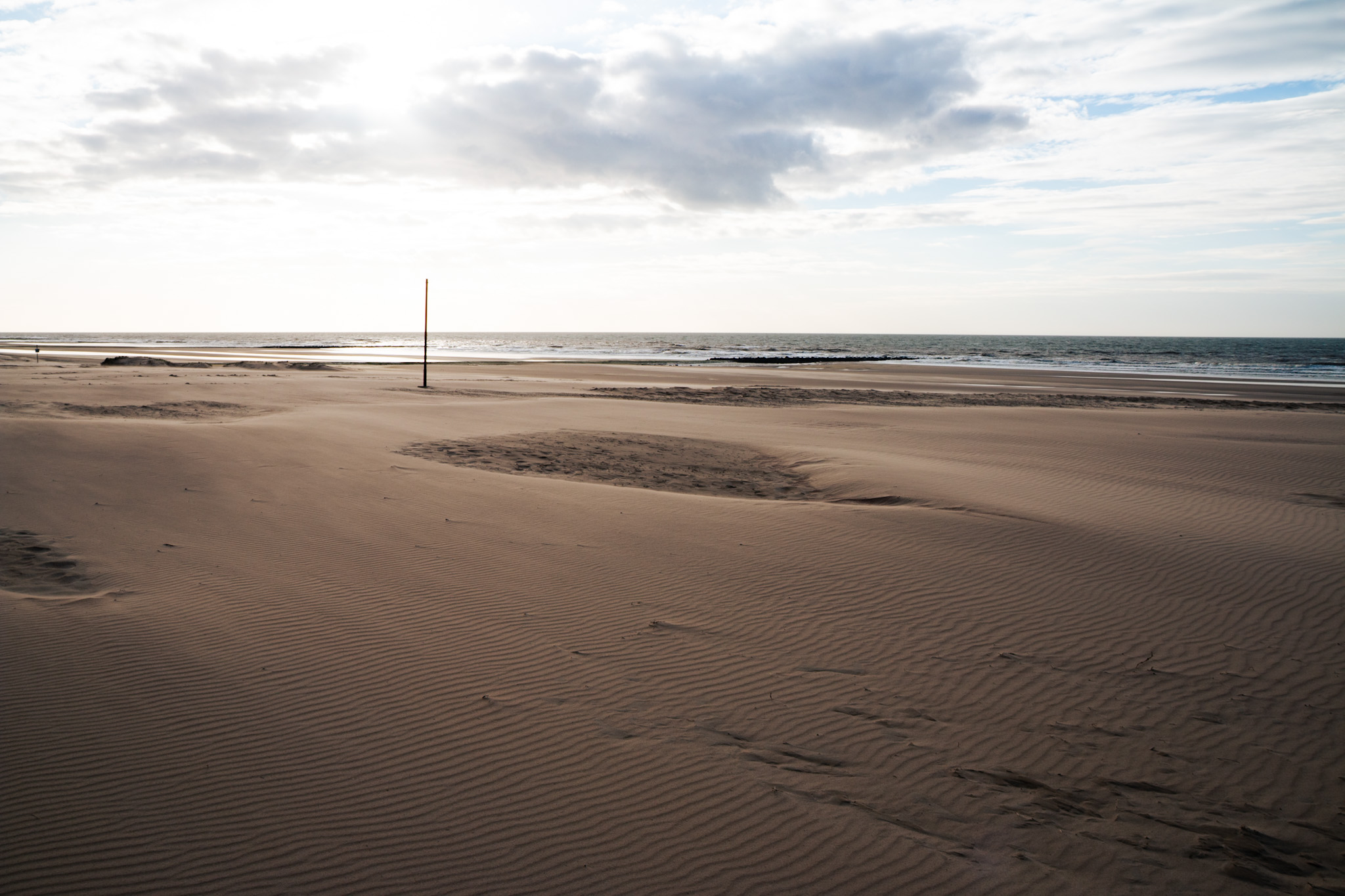Sunset at stormy beach