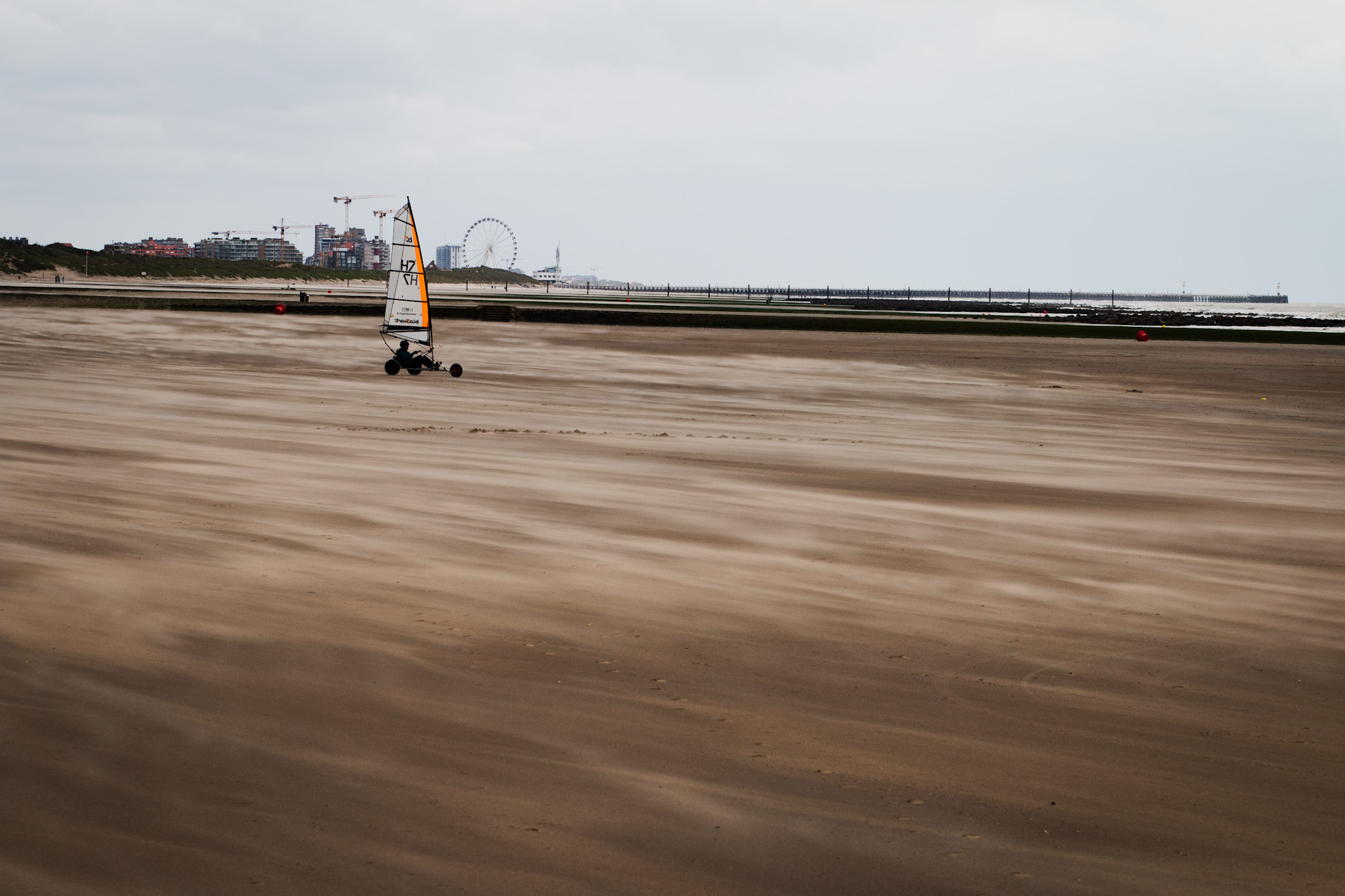 Incoming storm ar beach side, black and white, ferriswheel, landscape, beach surfer