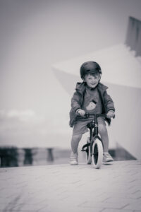 Boy on bike at beach